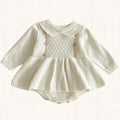 Ivory knit romper with quilted front panel, front view