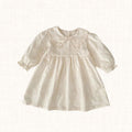 Ivory dress with floral embroidery and scalloped collar, front view