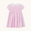 Pink dress with smocked bodice and white Peter Pan collar, front view