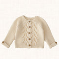 Beige knit cardigan with openwork leaf pattern and wooden buttons, front view