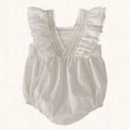 White romper with lace-trimmed ruffled straps, front view