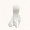 White ribbed tights with vertical texture, flat lay