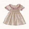Floral dress with hand-smocked bodice and ruffled blush-trimmed collar, front view