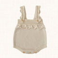 Ivory knit romper with ruffled straps, front view