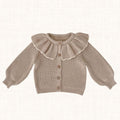 Sandy beige knit cardigan with scalloped ruffled collar, front view