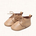 Caramel leather shoes with brogue detailing, side view