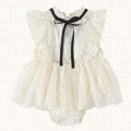 Ivory romper dress with lace trim and layered tulle skirt, front view