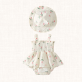 Cream floral print romper with smocked bodice and matching hat, front view