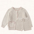 Off-white knit cardigan and shorts set, front view