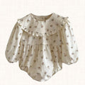 Ecru floral romper with ruffled collar and puffed sleeves, front view