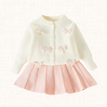 Cream knit cardigan with pink bows and pleated blush skirt, full set