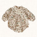 Floral print romper with puff sleeves and knot detail, front view