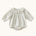 Cream romper with wide ruffle collar and floral embroidery, front view