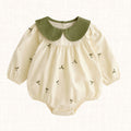 Cream romper with botanical embroidery and olive green collar, front view