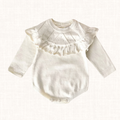 Ivory knit romper with ruffle yoke, front view